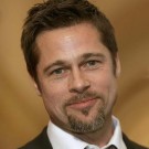 Actor Brad Pitt appears with House Speaker Nancy Pelosi before their meeting in Washington